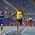 El velocista colombiano Ronal Longa corriendo con la camiseta número 184 en la pista de atletismo.